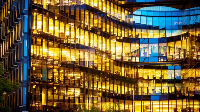 Glass building with lights on